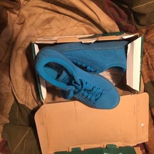 Blue suede pumas.